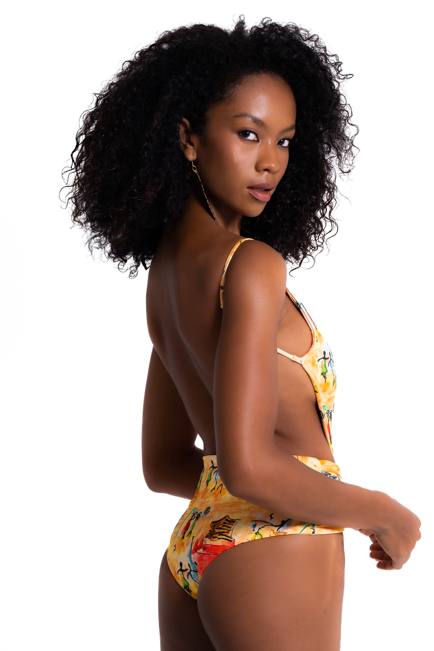 Woman wearing a colorful swimsuit on a white background
