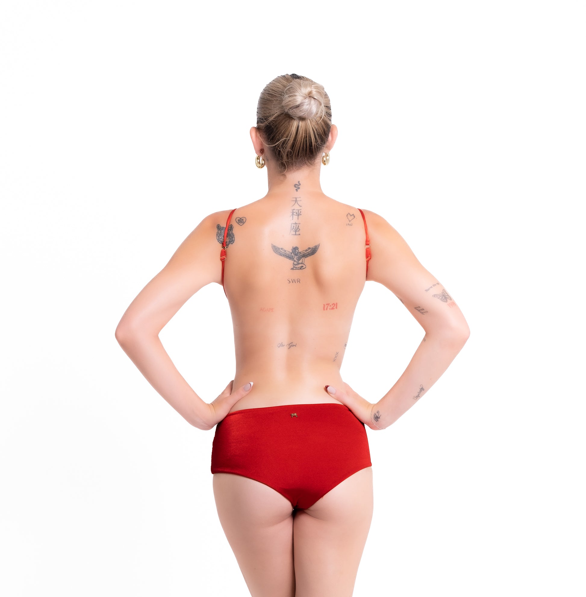 Person wearing a red swimsuit on a white background