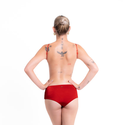 Person wearing a red swimsuit on a white background
