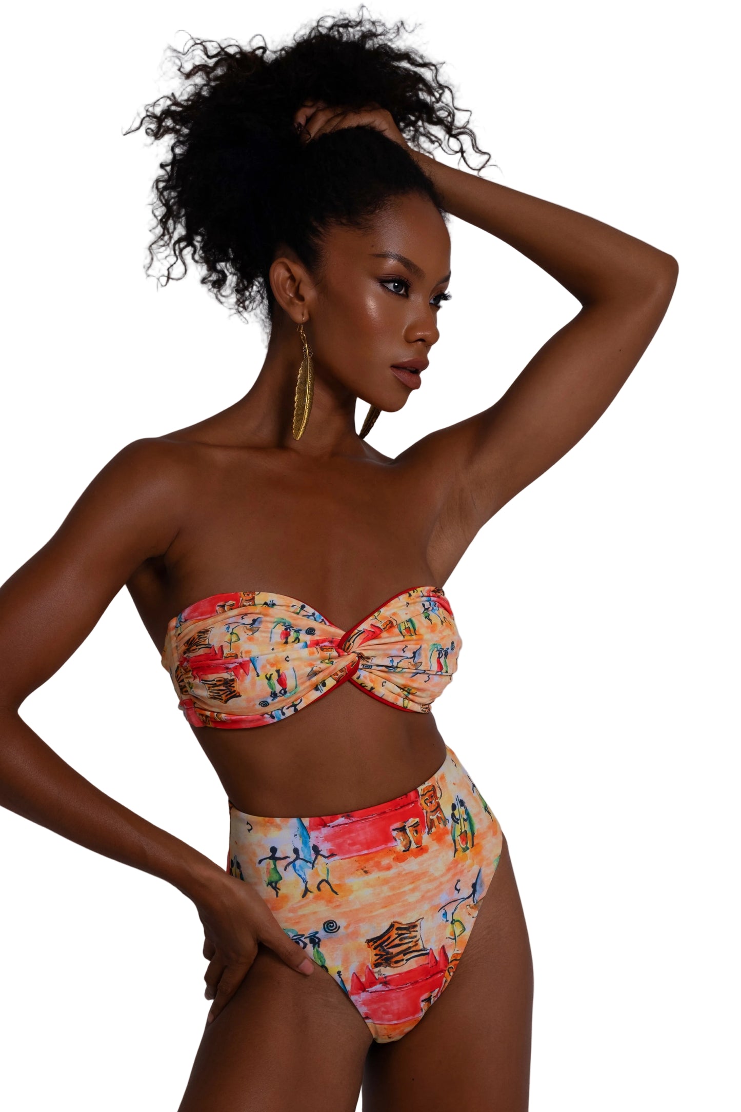 Woman wearing a colorful bikini with a pattern of people on a plain background